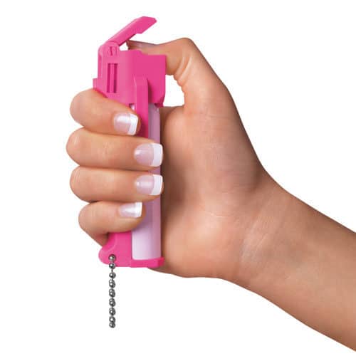 Mace® Personal Model Hot Pink 10% Pepper Spray Viewed in Hand with Thumb In Flip Top and on Action Button