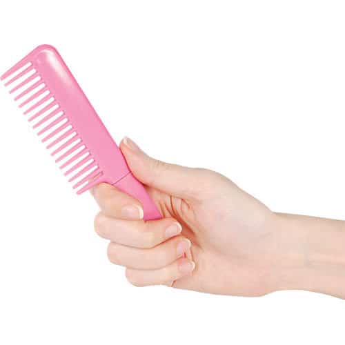 Pink Covert Comb Hidden 3.5 Inch Metal Knife Viewed in Hand