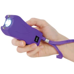 Purple Runt Stun Gun with Wrist Strap Shown In Hand