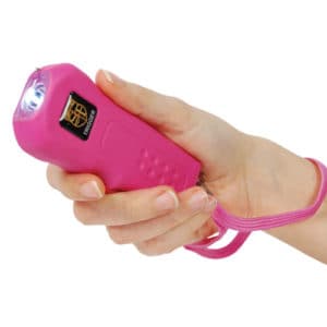 Pink Trigger Rechargeable Stun Gun Flashlight Viewed in Hand with Wrist Strap