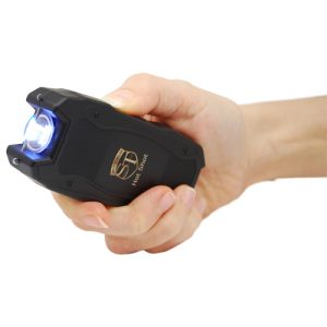 Hot Shot Stun Gun with Flashlight Side View in hand at an angle with Light Activated